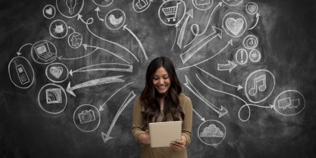 Girl on tablet with social media icon chalkboard